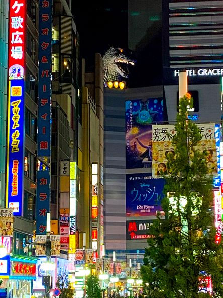 Godzilla peeking through the cinemas