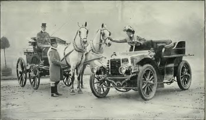 Horse carriage sharing road with a car